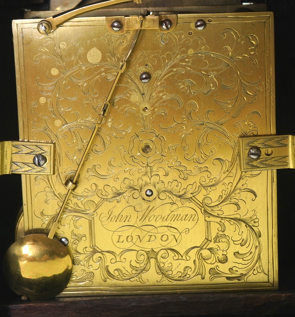 A George II walnut and brass mounted bracket clock, signed John Woodman